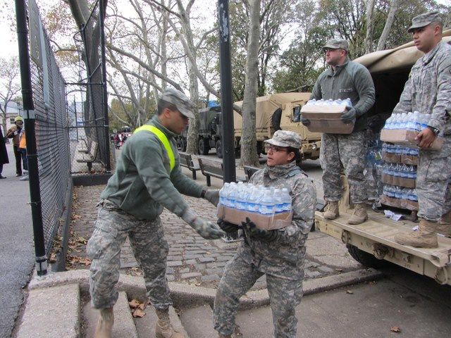 National Guard forming a bucket brigade to distribute supplies in Red Hook. 